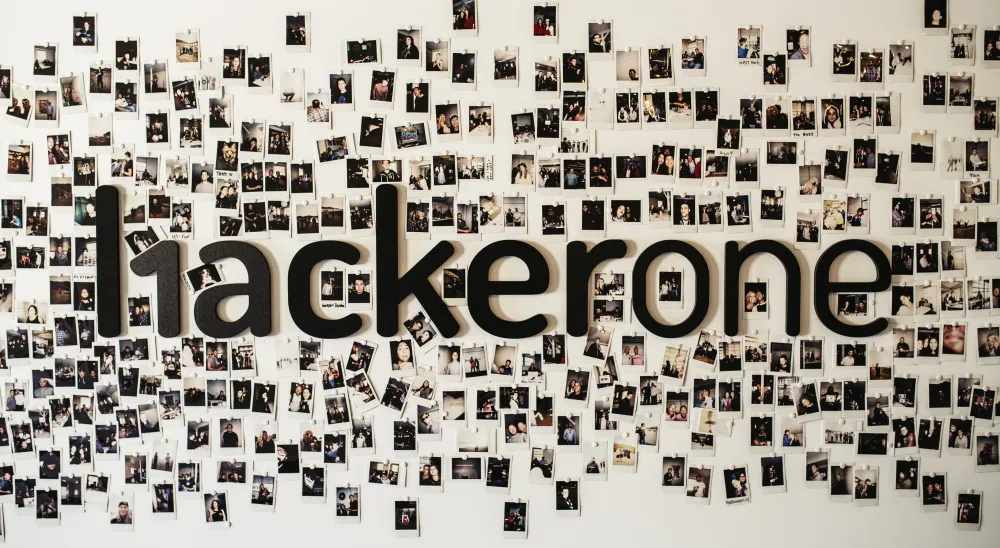 hackerone wall with small pictures of employees