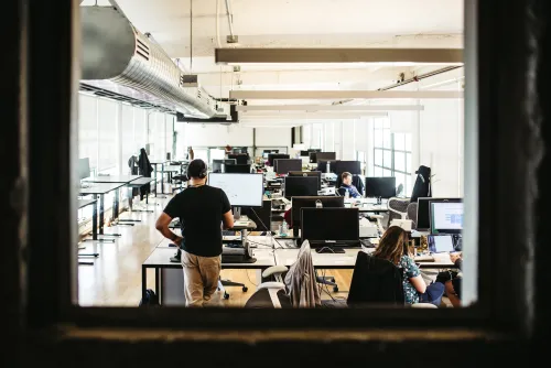 employees working in an open office space virtual