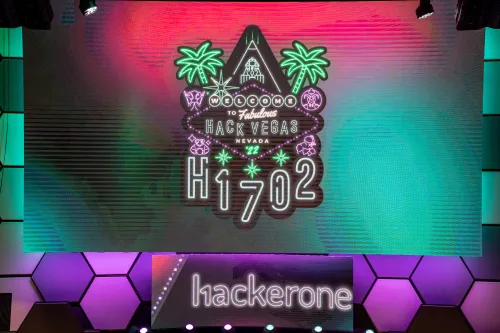 H1-702 logo