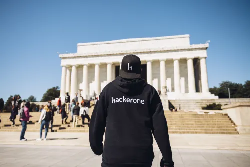 person with hackerone hoodie walking to lincoln memorial